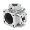 Hydraulic Pump Housing 7075-T6 Aluminum Hard Anodized — 3/4 above studio shot showing port faces, anodized bore, and hex flats