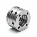Precision Drivetrain Coupling Sleeve 303 Stainless Steel 11-Axis Mill-Turn — studio shot showing external/internal spline geometry, journal surfaces, and drilled cross-holes